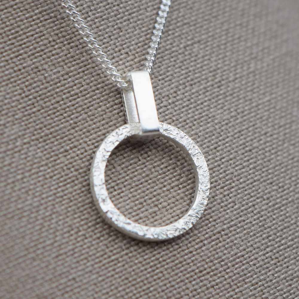 Textured small round pendant on a rectangle link