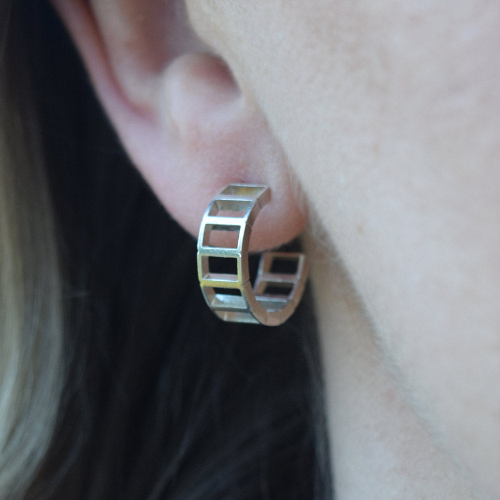 Huggie hoop earrings being worn